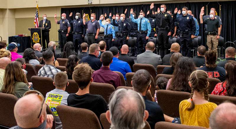 <b>Members of KLETC's 282nd Basic Training Class&nbsp;recite the Law Enforcement Oath of Office in front of the attending audience Friday afternoon.</b> Photo by Jason Levy courtesy KLETC