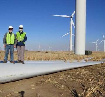 <b>Russell Gentry, associate professor of architecture and civil engineering at Georgia Tech, and student Chloe Kiernicki stand at the Smoky Hills Wind Farm in Lincoln County.</b> (Re-Wind)