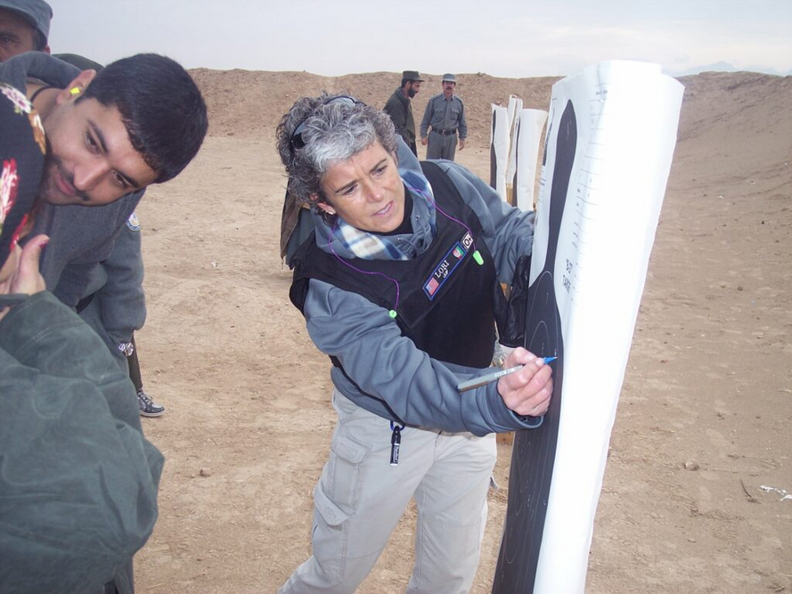 Lori Reeves scores an Afghan woman’s target shooting during firearms training in 2009. (Submitted)