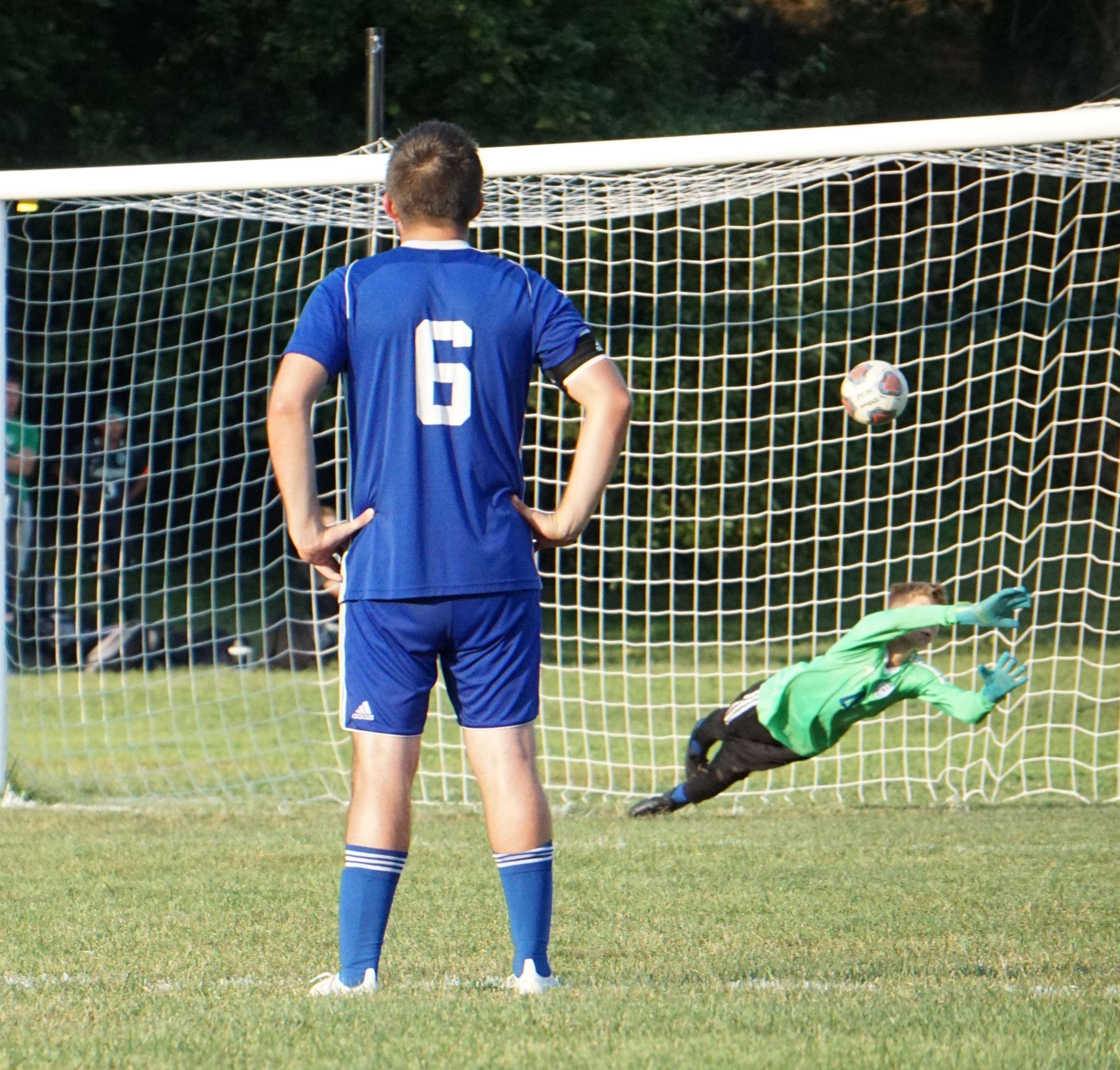 Central's Grayson Matthews (6) looks on as LeBlond's Eli Spencer's penalty kick makes it past goalie Charles Klein. Photo by Tommy Rezac.