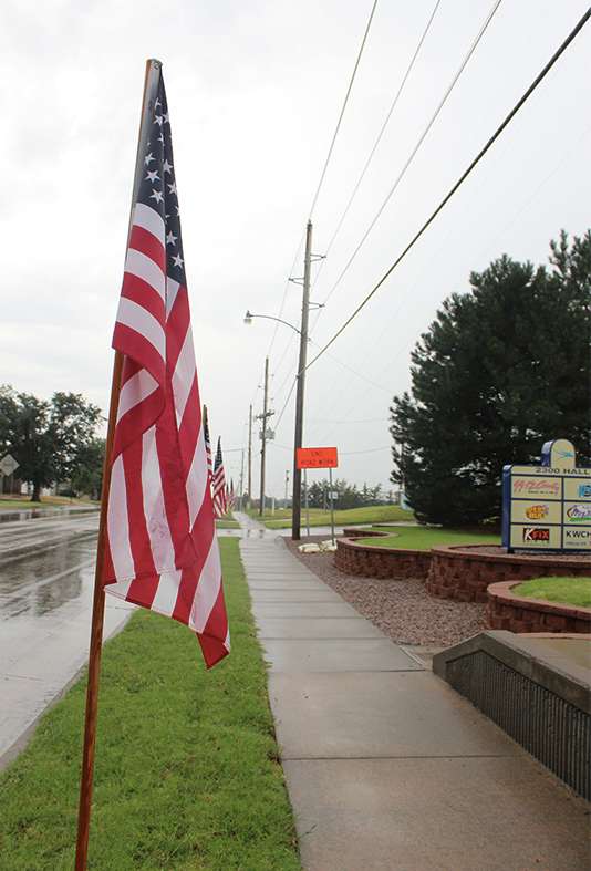 One of 13 flags posted on Hall Street to honor the 13 U.S. armed service personnel who died in a bombing attack last week during the evacuation of Afghanistan. 