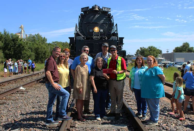 Union Pacific officials present First Call for Help of Hays a $10,000 check to assist local residents with utilities, food and housing. Pictured from left to Right are Hays City Commissioner Shaun Musil; Terri Braun, First Call for Help board member; Samuel Allen, First Call for Help volunteer; Sandy Jacobs, Hays mayor; Scott Moore, Union Pacific; Linda Mills, First Call for Help executive director; Ed Dickens, Union Pacific manager of heritage equipment; Ben Jones, Union Pacific public affairs; Laura Shoaff, First Call for Help office assistant/program coordinator; and Laura Allen,&nbsp;First Call for Help client services specialist.