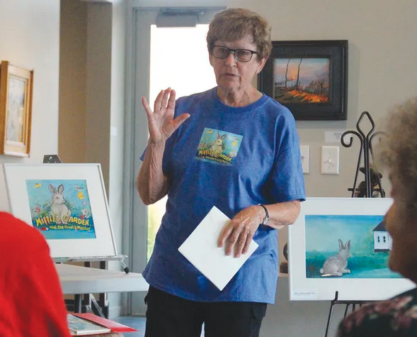 Artist and illustrator Kathleen Kuchar, a professor emerita at Fort Hays State University, speaks at the Vernon Filley Museum in Pratt on Friday. Photo by Jennifer Stultz / Pratt Tribune.