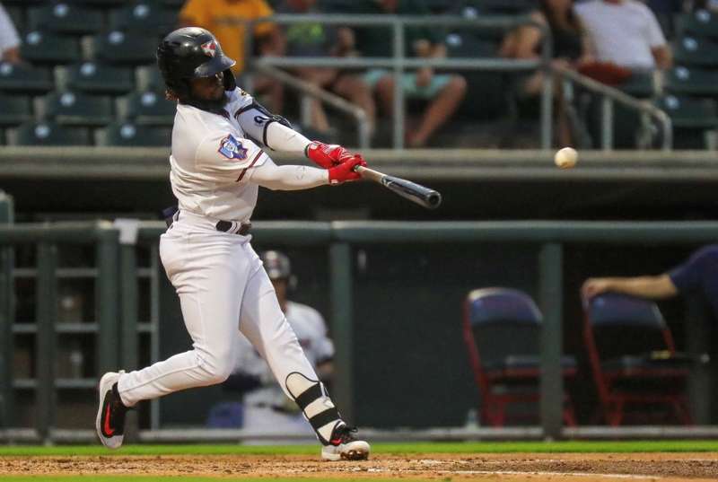 <b>D.J. Burt hits a double to left.</b> Photo courtesy Wichita Wind Surge