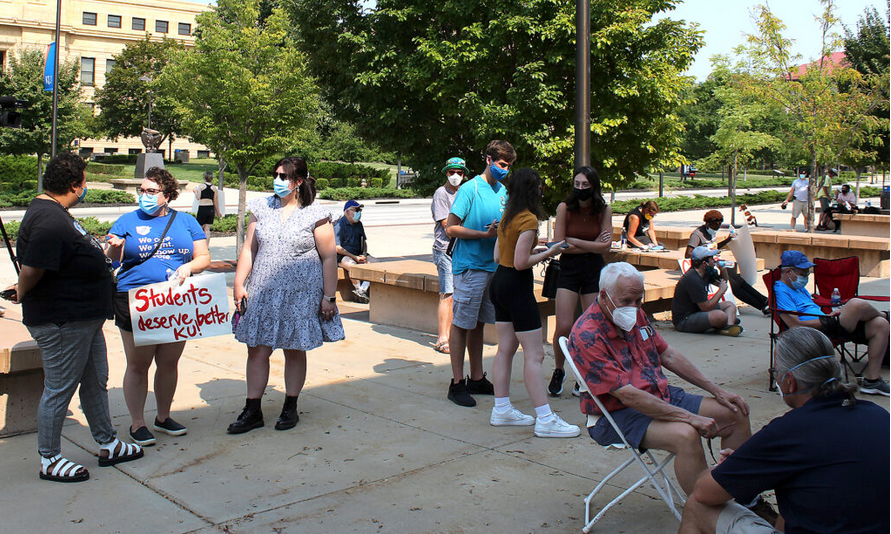 About 40 people attended Sunday’s rally to express safety concerns amid the surge of the delta variant of COVID-19. (Lucy Peterson for Kansas Reflector)