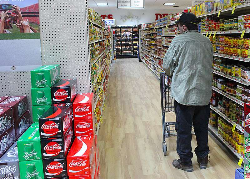 A shopper browses the aisles at Girard's Grocery in Osborne. Since 2008, 50 independent grocery stores in Kansas have closed, leaving many rural communities in food deserts.