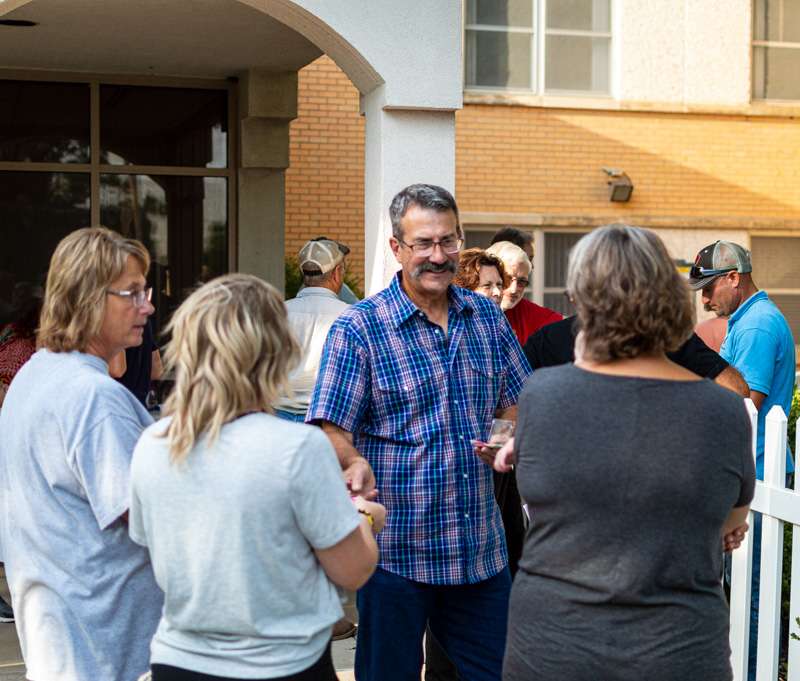 Jeff Pfeifer, Victoria Community Coalition chair, discusses the future of the former St. John rest home with community members shortly after its purchase in 2021. Photo by James Bell/Hays Post