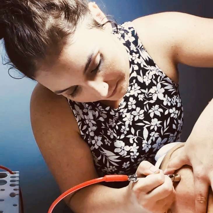 Paige Edwards, the new esthetician at Renue Salon, Spa & Fashion Boutique, provides microdermabrasion for a client. The procedure treats light scarring, discoloration, sun damage and stretch marks.