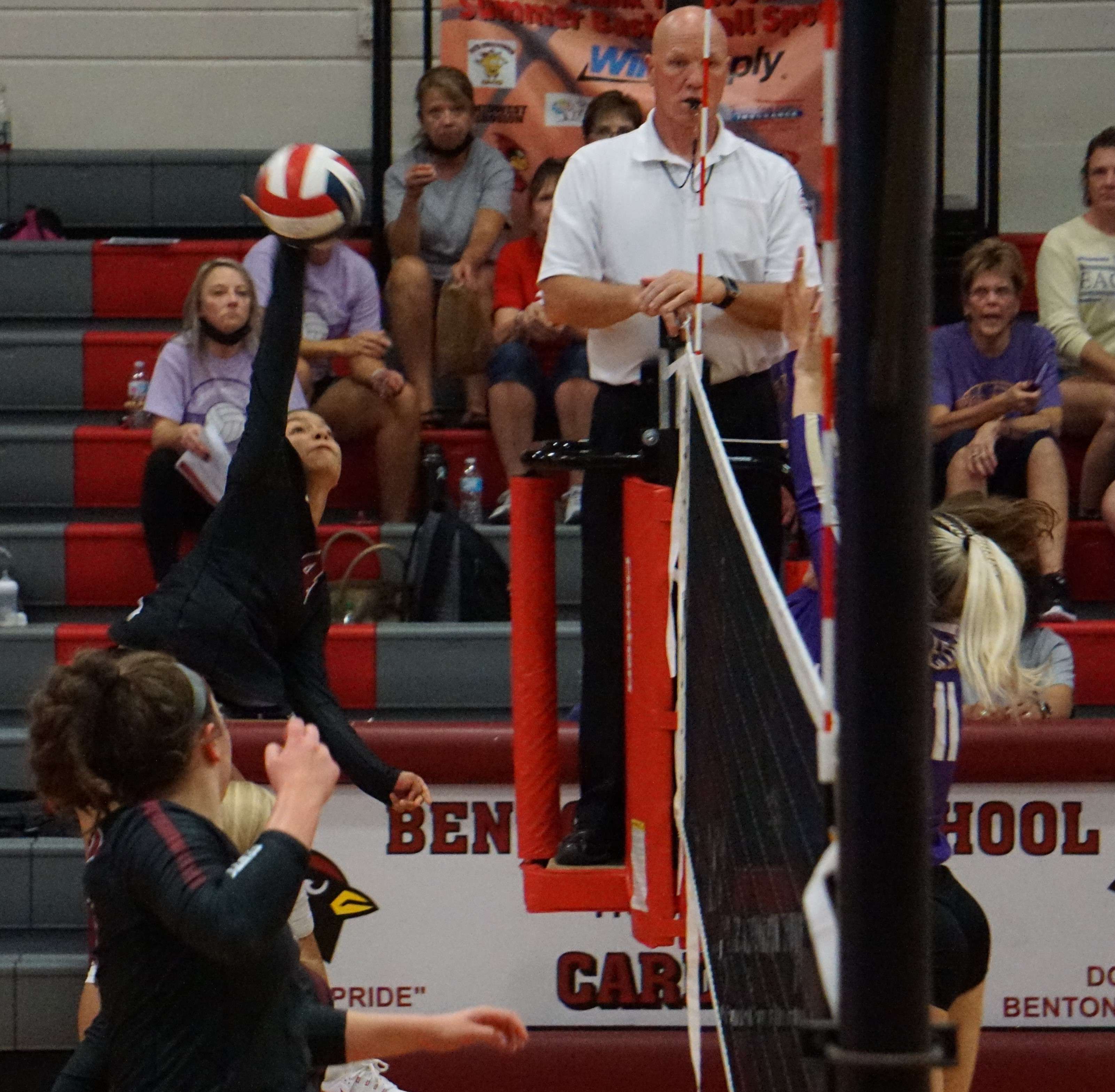 Alyia Stillman (left) looks to hit a ball past LeBlond's Paige Perry. Photo by Tommy Rezac.