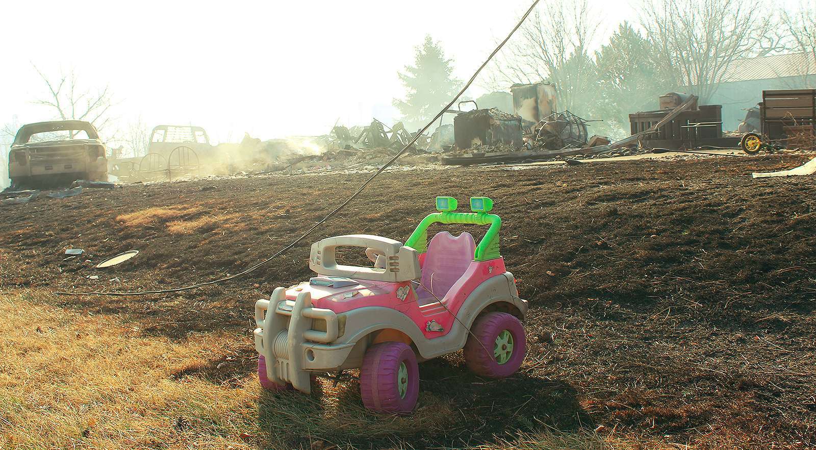 A child's toy is all that is left after a house in Paradise was burned to the ground on Dec. 15 as high winds tore through Russell County. Photo by Cristina Janney / Hays Post