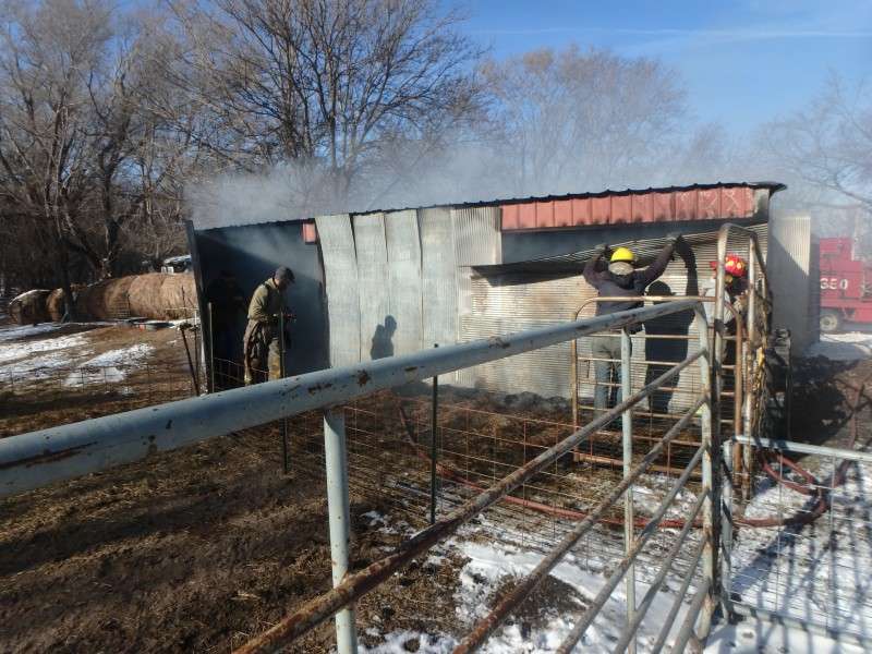<b>Rural Fire District No. 3 personnel work to extinguish a shed fire in northern Saline County. </b>Photo courtesy Saline County Sheriff's Office