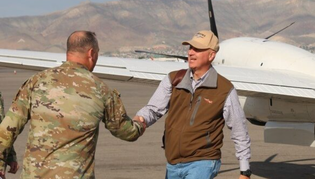 Gov. Pete Ricketts greets a Nebraska National Guard soldier deployed to Texas during a weekend visit. (Courtesy of the Governor’s Office)