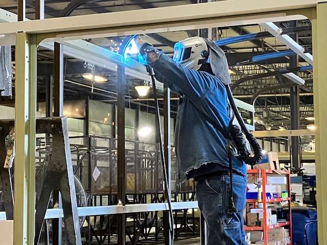 Welders assemble the roll cages that form the body of the bus. The cage must meet standards for safety.&nbsp;