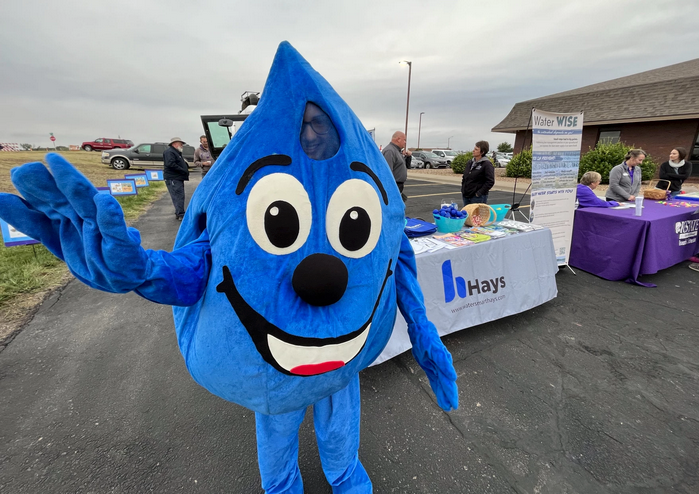 WaterSmart Wally greets families as they come up to the city's water conservation table at a recent street fair. David Condos / Kansas News Service