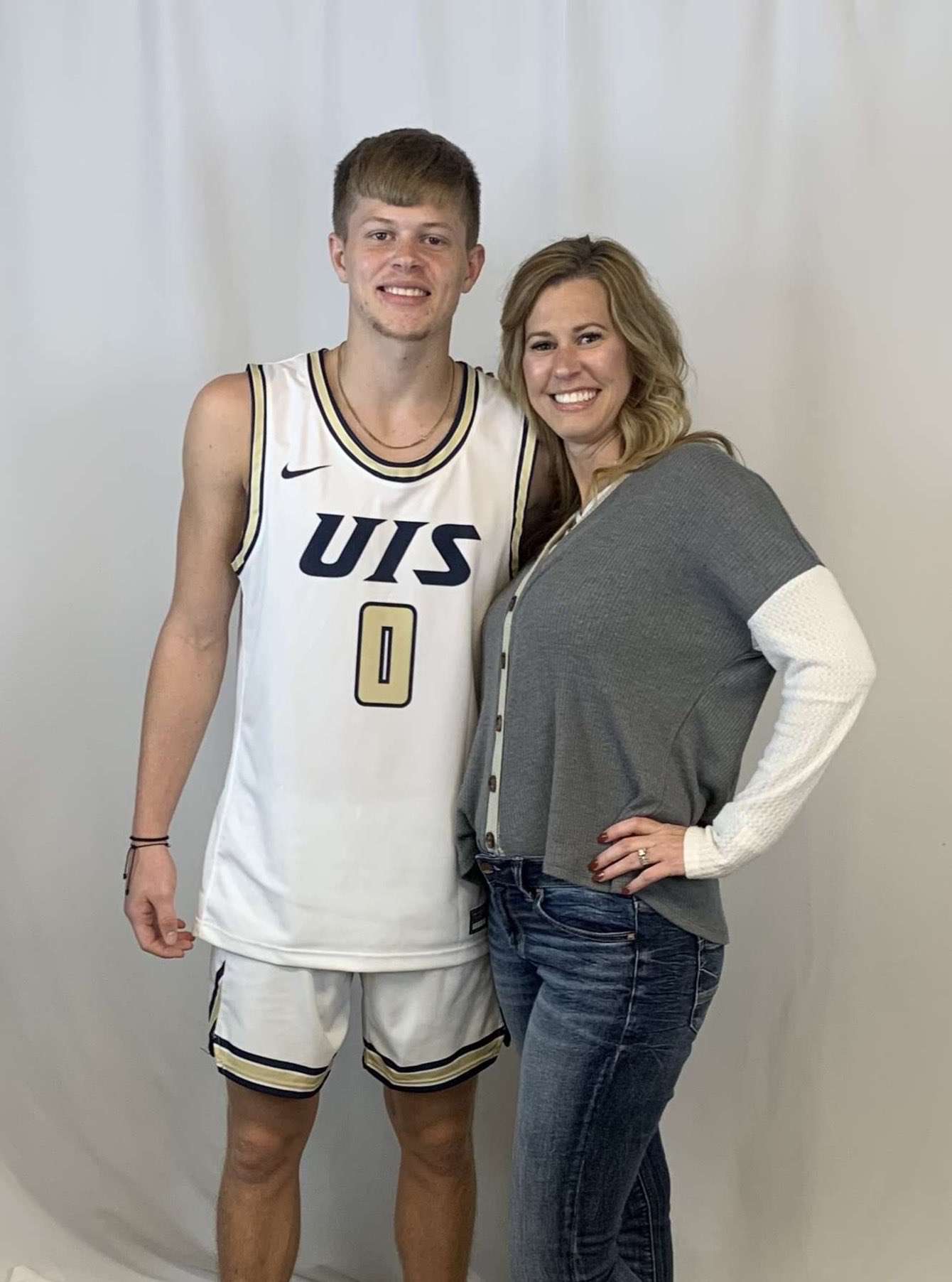 Ellinwood senior Brit Dutton, pictured with his mother, Meredith Joiner, will enter his final season as the all-time leading scorer at EHS. This week Dutton verbally committed to continue his basketball career at the University of Illinois-Springfield.