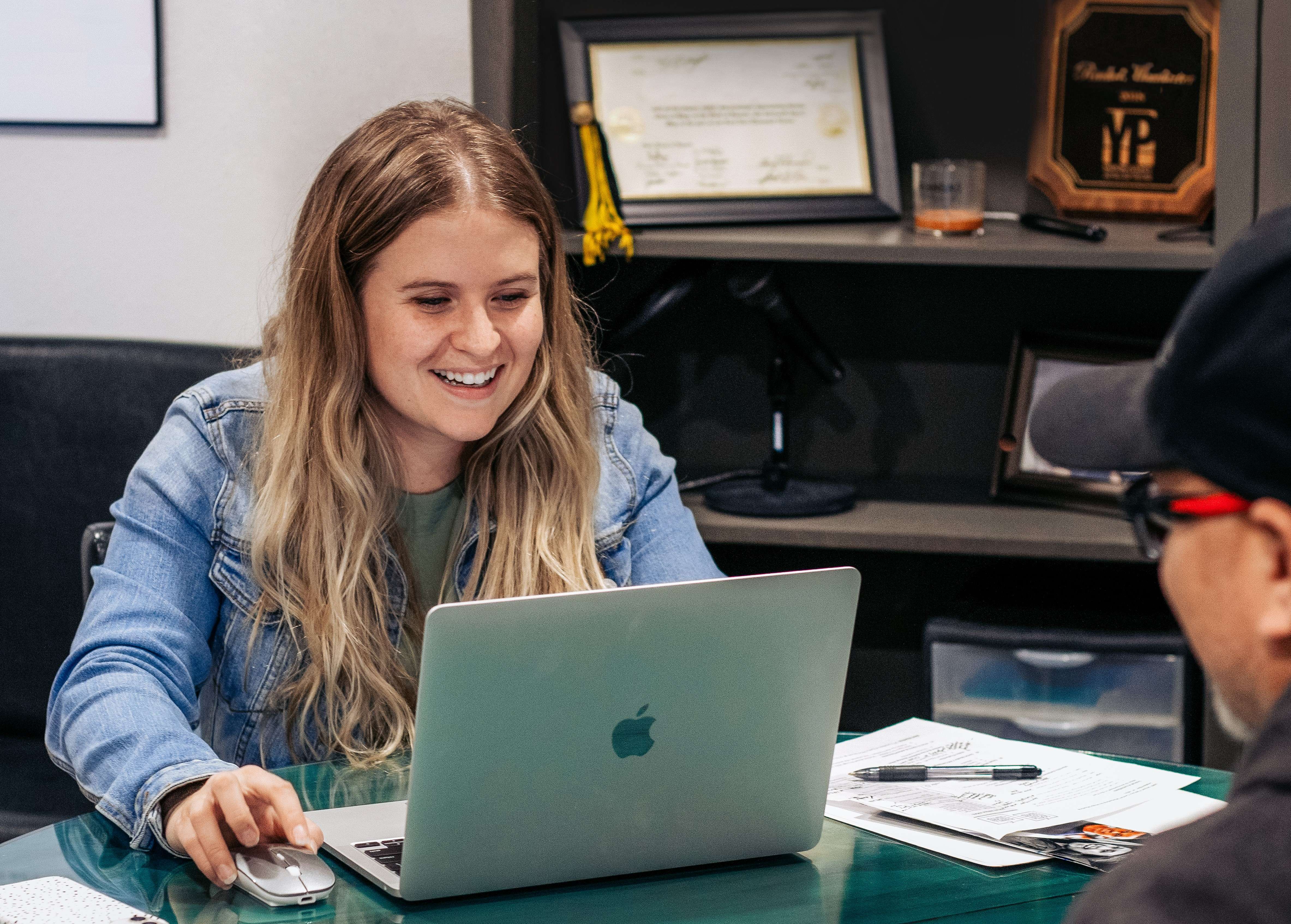 Natalie Klima, one of Marketing Maven's team members, consults with a client on a new website project. Marketing Maven is based in Great Bend and serves clients throughout the state of Kansas.