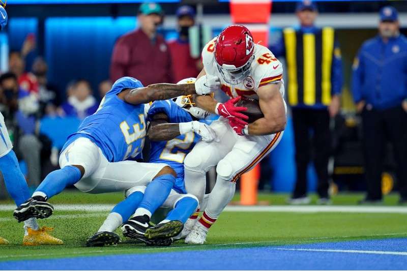 <b>Kansas City Chiefs fullback Michael Burton scores a touchdown during the first half of an NFL football game against the Los Angeles Chargers on Dec. 16, 2021, in Inglewood, Calif. In the past two decades the fullback become nearly extinct, as teams grapple with roster limits and salary cap restraints that force general managers to value players that can do a little bit of everything.</b> (AP File Photo/Ashley Landis)