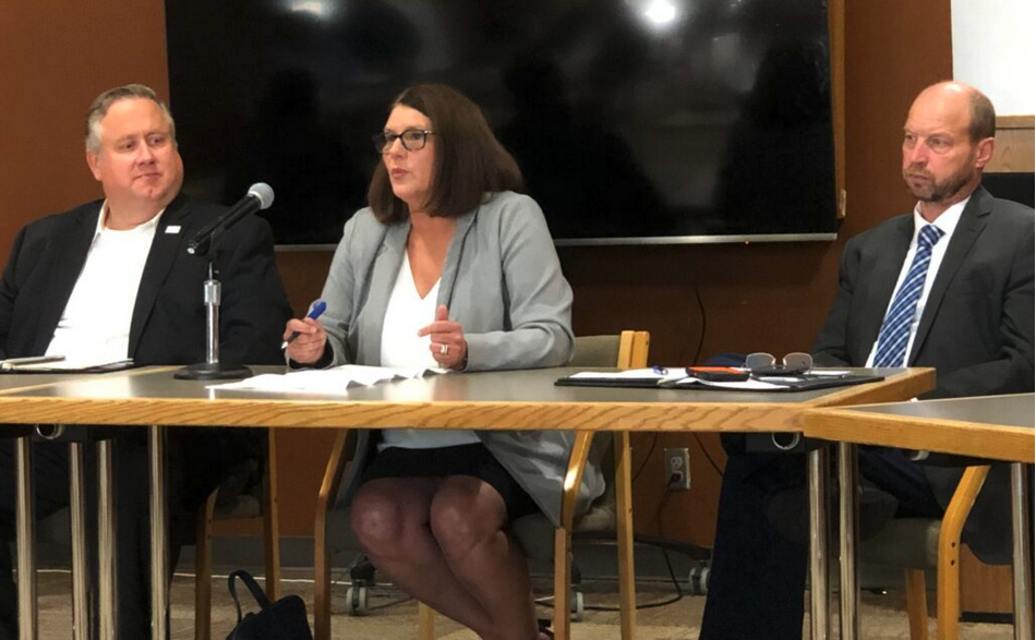 Kim Evans, Director of Family Support Division, speaks at a media event Aug. 26, alongside Robert Knodell, acting director of the Department of Social Services (left) and Patrick Luebbering, chief financial officer of the Department of Social Services (right) (photo by Clara Bates/Missouri Independent).
