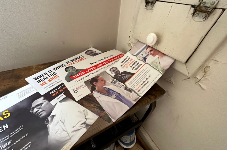 Mailers continue to pour into Nebraska mailboxes at a high rate. Shown here are some from the 2nd Congressional District in Omaha. (Aaron Sanderford/Nebraska Examiner)