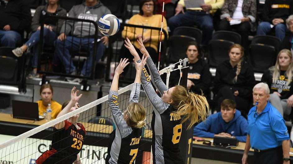 FHSU's Morgan Christiansen (7) and Claire Olson (8) attempt a block vs. Pittsburg State Friday at Gross Memorial Coliseum. (FHSU Athletics photo)