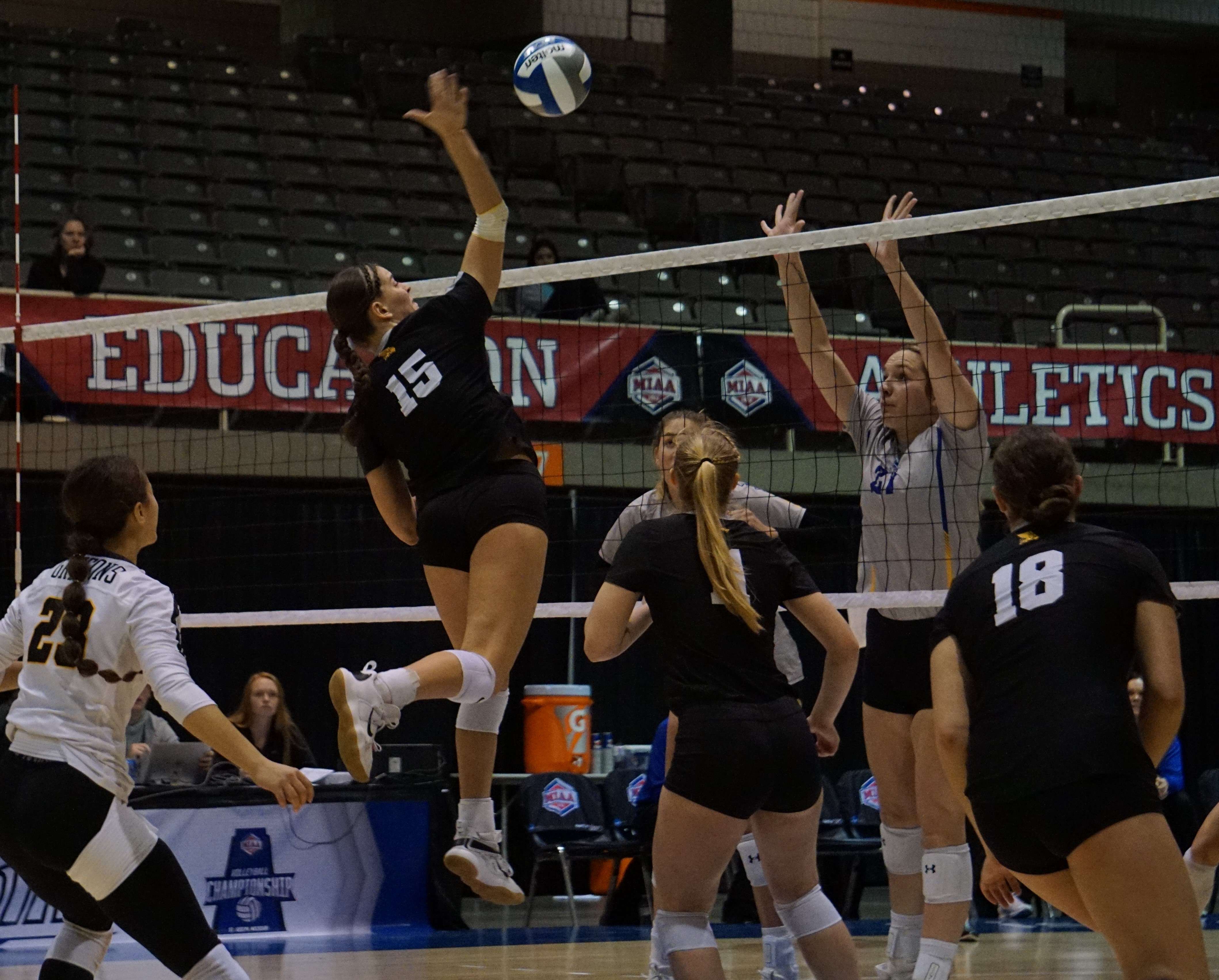 Missouri Western's Emma Salker (15) goes for a kill through the middle early in the Griffons' 3-0 loss to No. 2 seed Nebraska-Kearney in the MIAA tournament at Civic Arena in St. Joseph Thursday. Photo by Tommy Rezac.