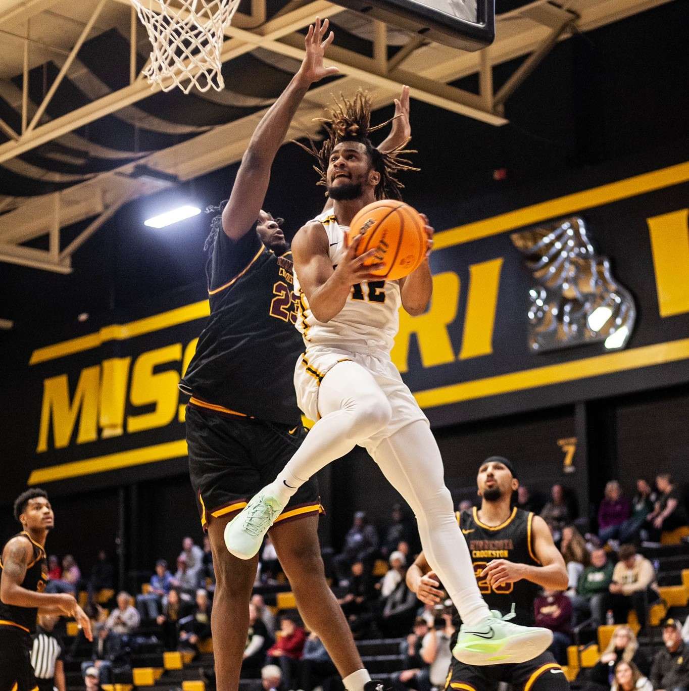 Missouri Western's Zion Swader (12) goes up for two during the Griffons' 81-76 overtime win against Minnesota-Crookston Friday at the MWSU Fieldhouse. Photo by Arianne Boma.