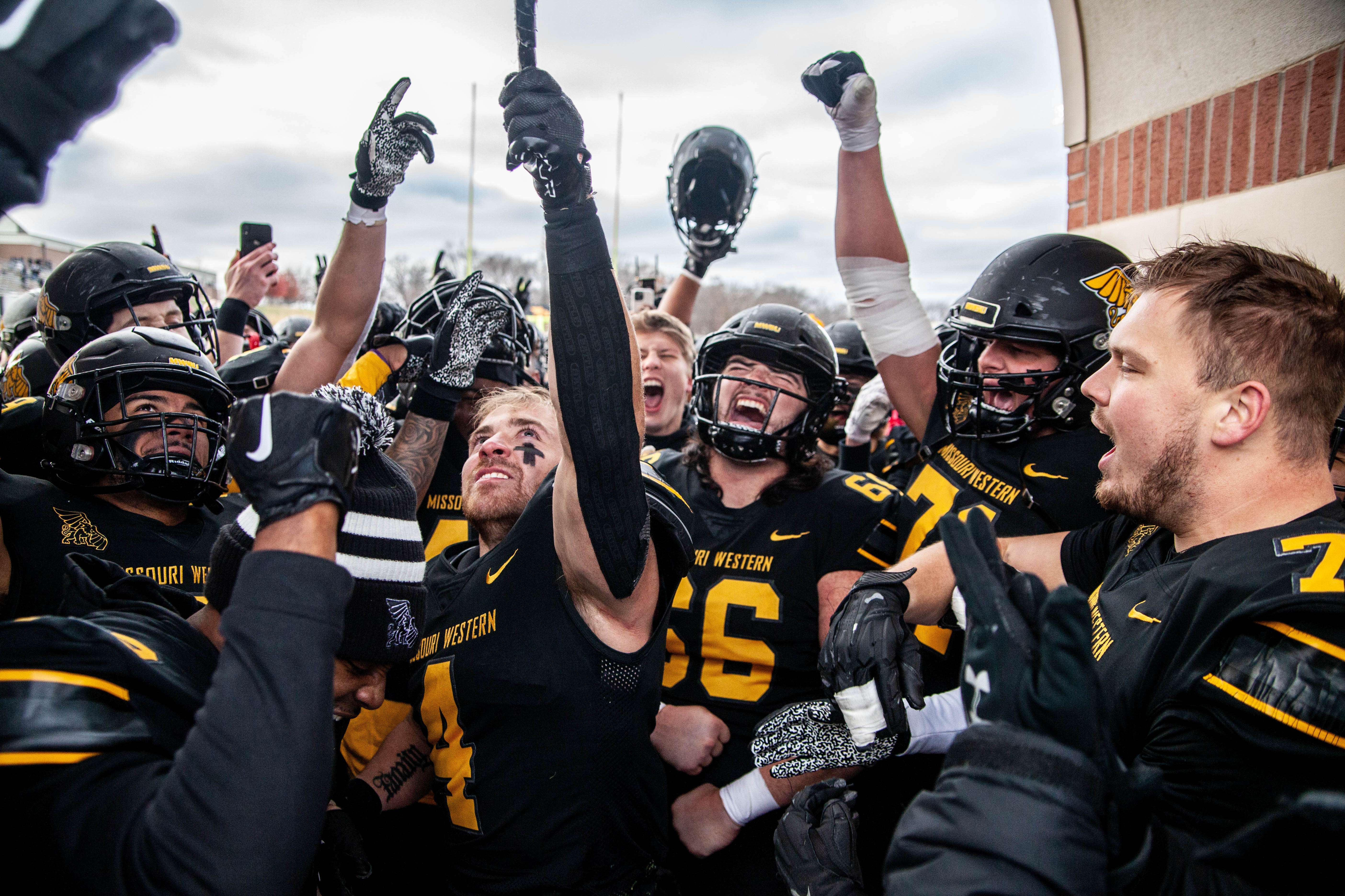 Missouri Western's Titus McCoy (4) rings the bell following a school record 289 yards rushing in a 41-0 win over Lincoln at Spratt Stadium in St. Joseph Saturday. Photo by Arianne Boma.