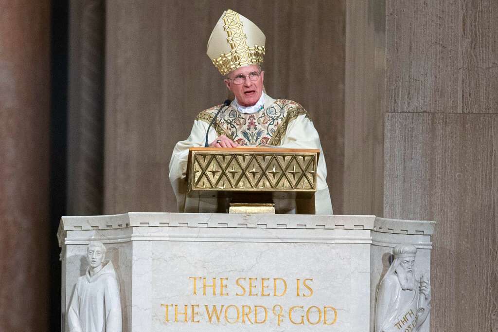 Archbishop Timothy Broglio conducts an Easter Sunday Mass in an empty sanctuary at Basilica of the National Shrine of the Immaculate Conception in Washington, Sunday, April 12, 2020. Broglio of the Military Services, who oversees Catholic ministries to the U.S. armed forces, was elected Tuesday, Nov. 15, 2022, as the new president of the U.S. Conference of Catholic Bishops. (AP Photo/Jose Luis Magana)