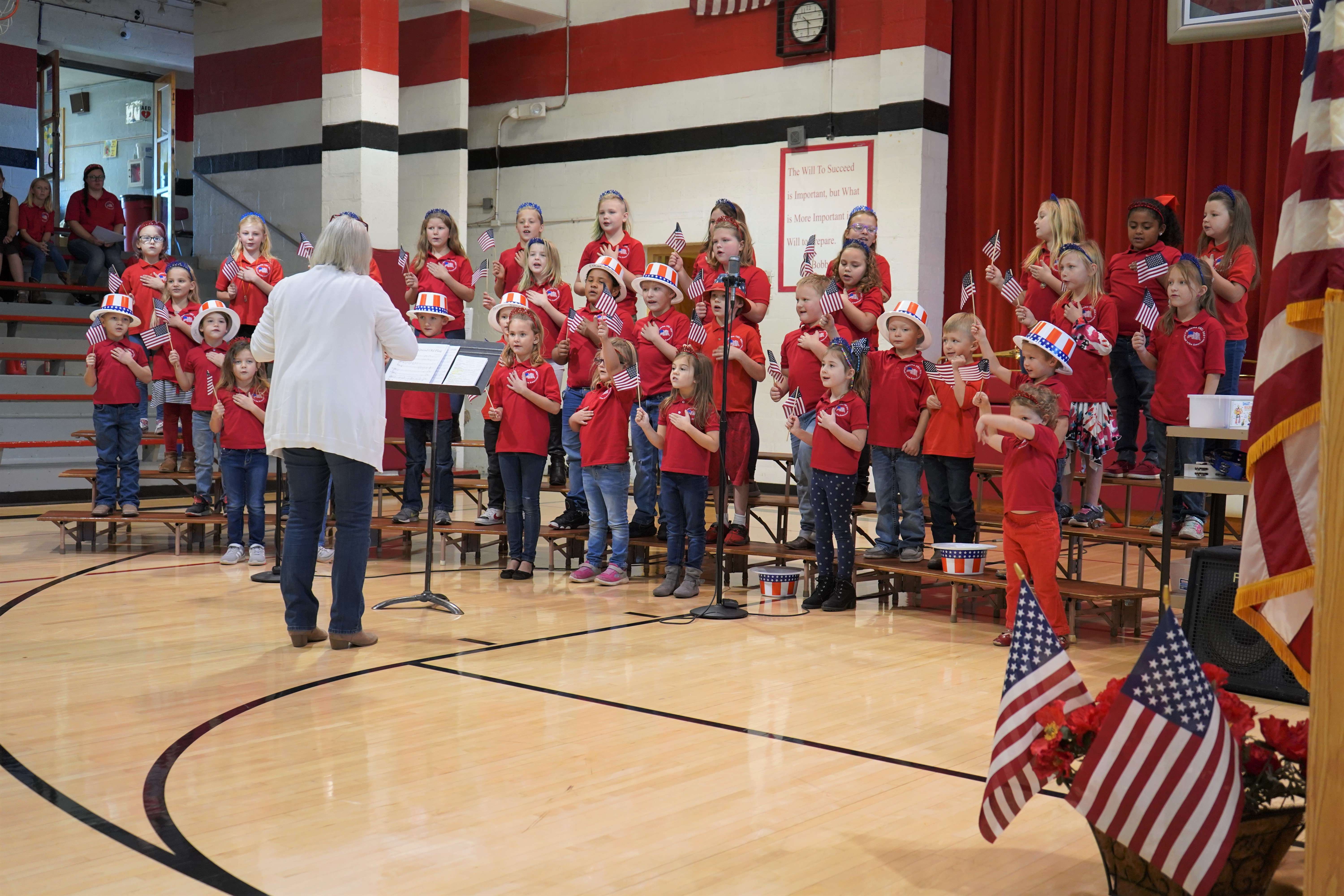 "You’re a Grand Old Flag" in song and choreography honored veterans during the Veterans Salute co-hosted by the American Legion Auxiliary Unit 109 and Natoma-Paradise-Waldo Unified School District 399. Photo by Laah Tucker