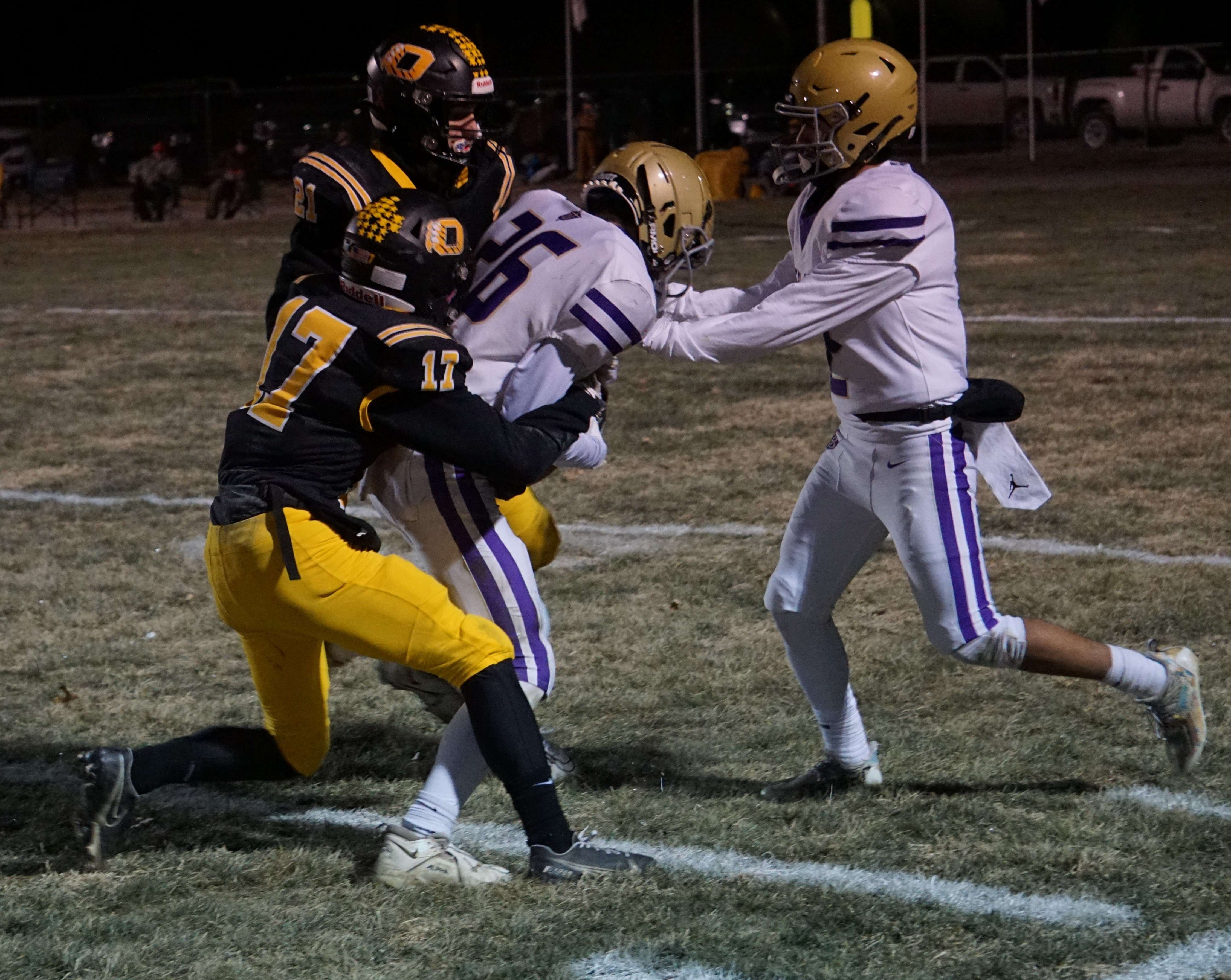 Jacob Winkelbauer (26) drags a defender with him.