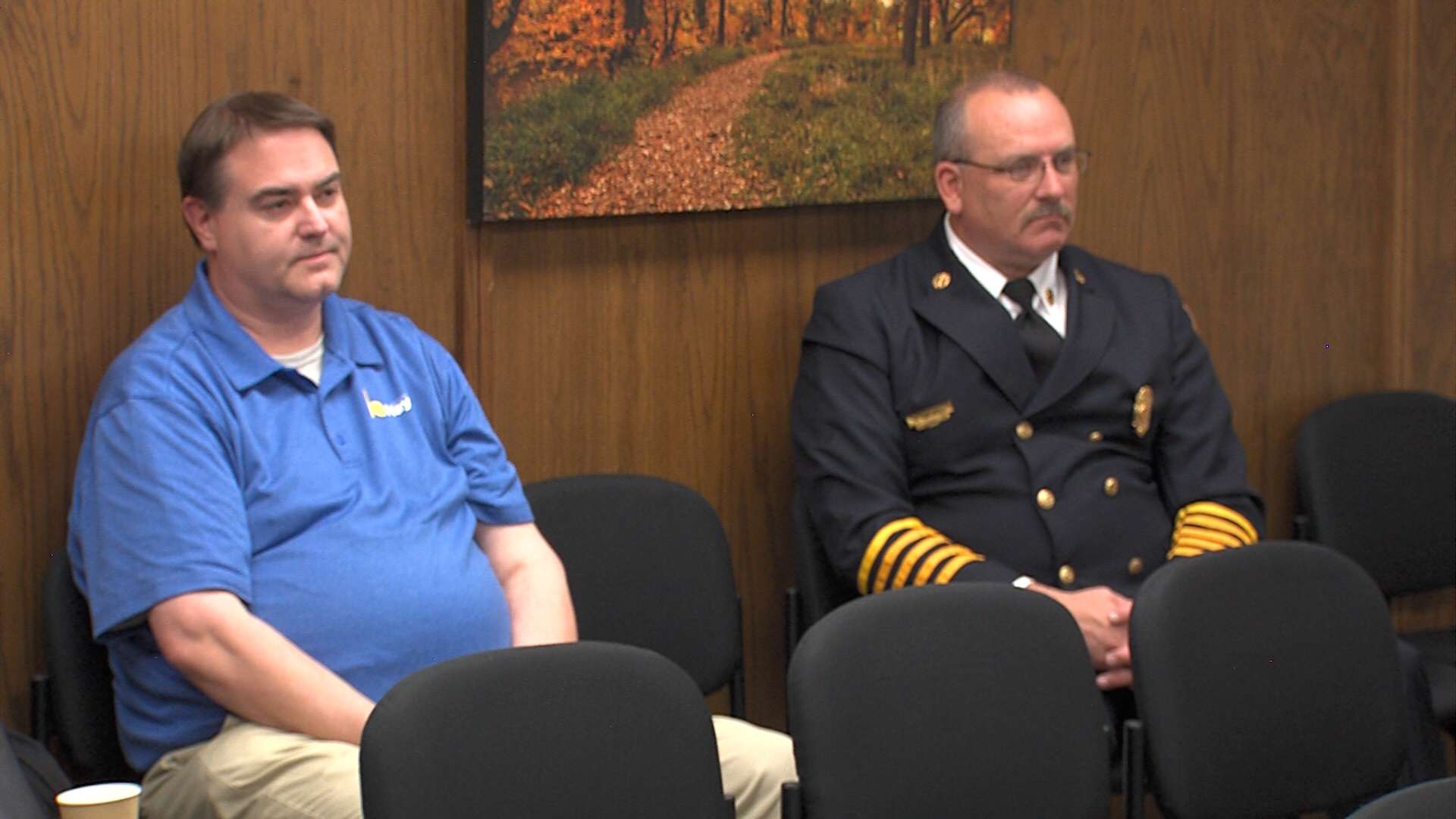 Chad Ruder, Hays IT director, and Ryan Hagans, Hays fire chief, listen to the discussion of the bid award for a third fire station in the city. (Photo By Becky Kiser/Hays Post)