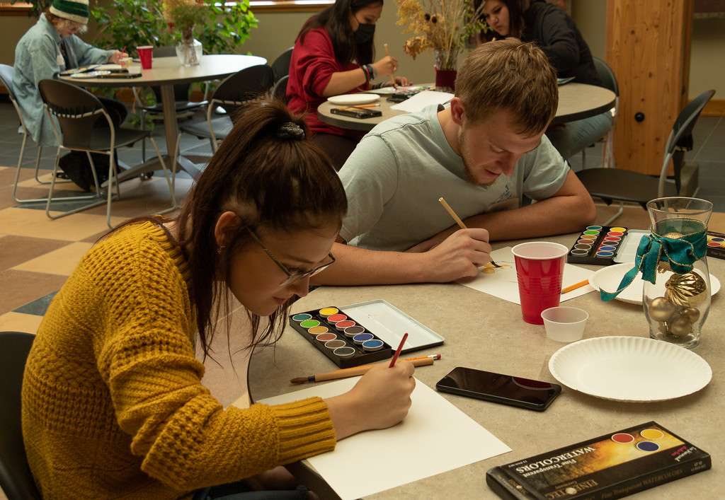Teagan Burney, left, and Keagan Hitchcock, both of Hemingford High School, paint with watercolors Nov. 8, 2022, in the Sandoz Center as part of CSC Art Day. (Photo by Tena L. Cook/Chadron State College)