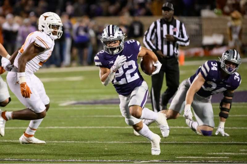 <b>Kansas State running back Deuce Vaughn (22) carries the ball against Texas during the second half of the game Nov. 5 in Manhattan.</b>&nbsp;(AP File Photo/Reed Hoffmann)