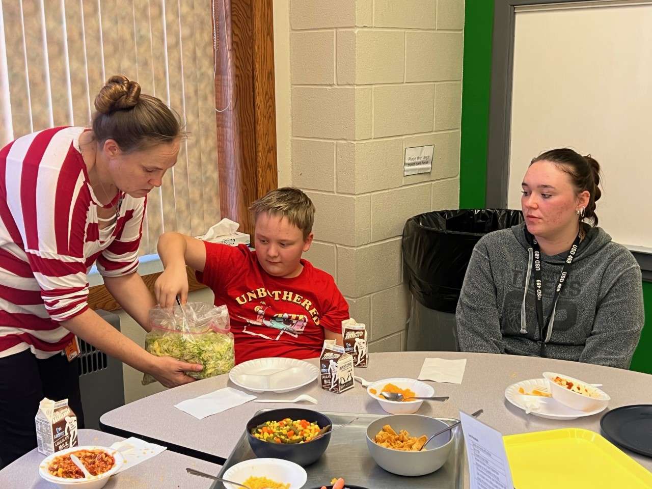 Westside students and staff eat family-style thanks to a grant from the Robert E. Patricia A. Schmidt Foundation. Courtesy photo<br>