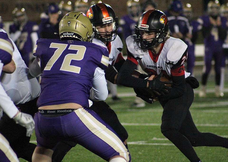 North Andrew's Hayden Ecker (24) gets a handoff during the Missouri 8-man state championship game in Columbia Thursday. Photo by Anthony Crane.