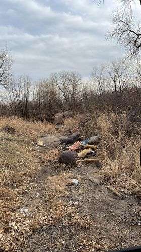 A recent photo shows garbage is still an eyesore and environmental issue around the river.