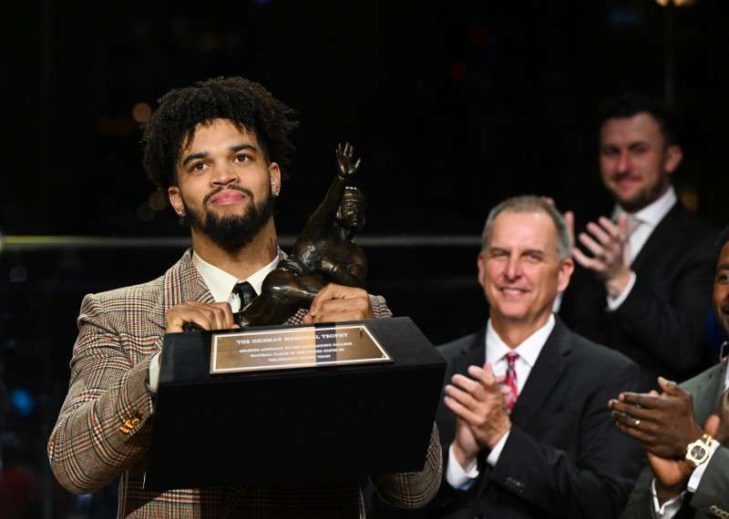 <b>Southern California quarterback Caleb Williams holds the Heisman Trophy after winning the award Saturday in New York.</b> (Todd Van Emst/Pool Photo via AP)