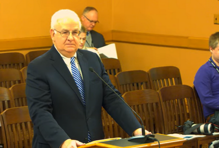 Mark Burghart, secretary of the Kansas Department of Revenue, urged state legislators to stay in the 24-state sales tax compact because it efficiently expanded compliance with tax law among out-of-state companies doing business in Kansas. (Kansas Reflector screen capture from Kansas Legislature YouTube channel.)