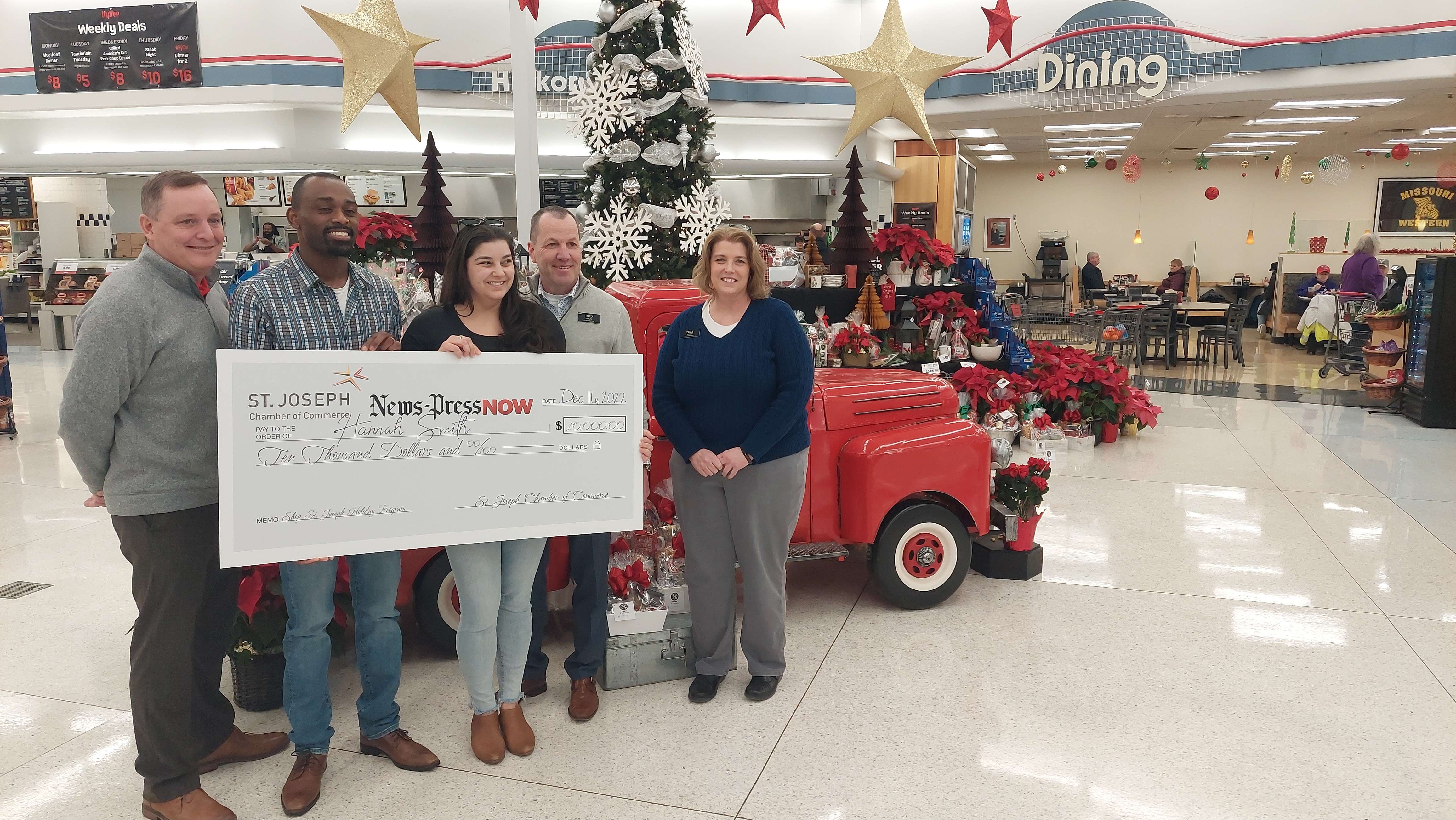 Shop St. Joseph winners Hannah and Marquest Smith stand with representatives from the St. Joseph Hy-vee where they received the winning ticket/ Photo by Matt Pike