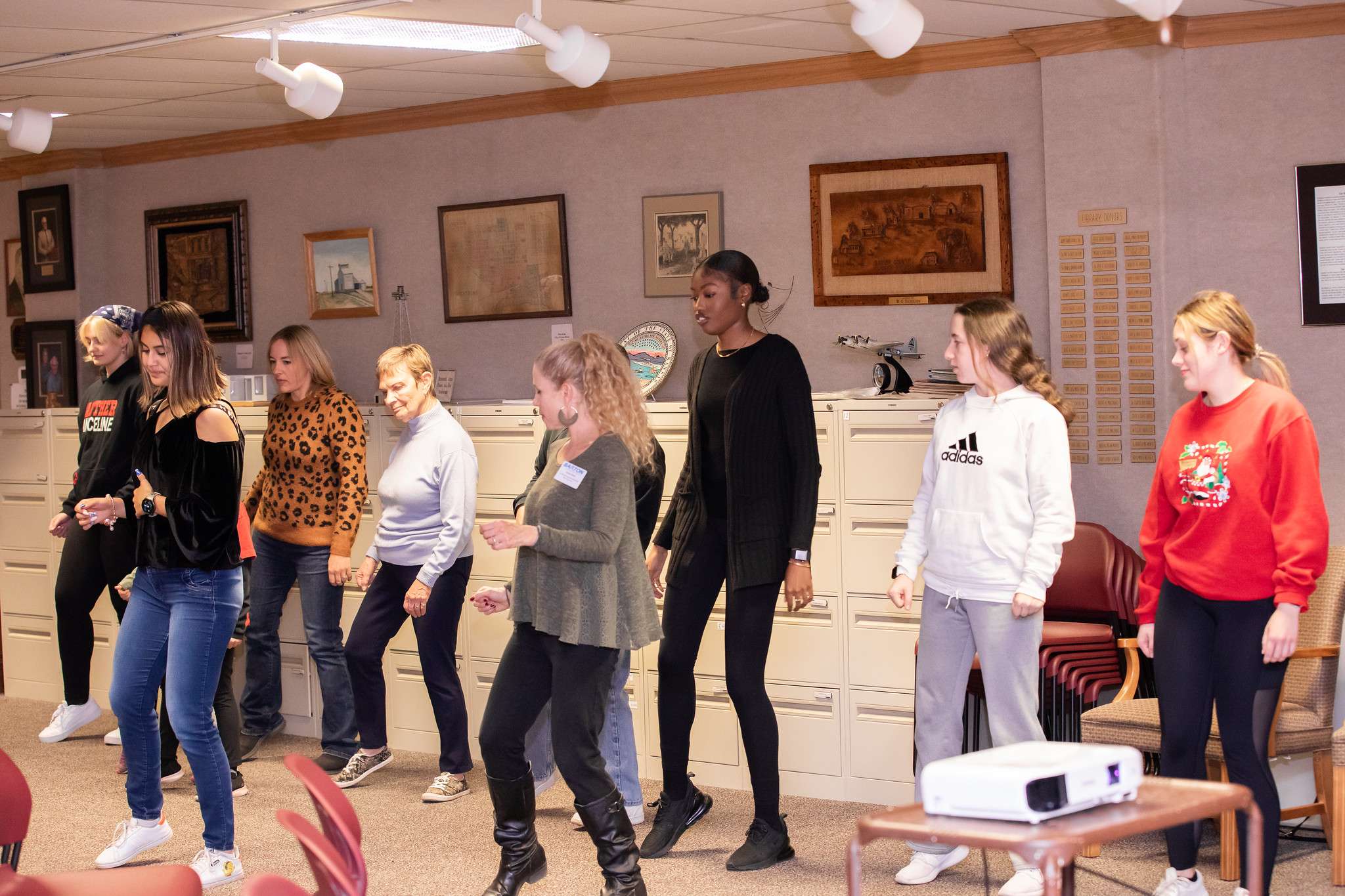 Community members learn a dance from Barton dance class students at an event at the end of the fall semester.