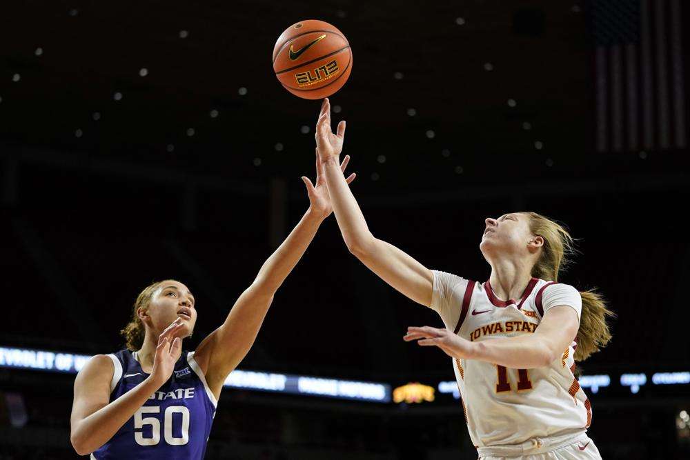 Iowa State guard Emily Ryan (11) shoots over Kansas State center Ayoka Lee (50) during the first half of an NCAA college basketball game, Wednesday, Feb. 2, 2022, in Ames, Iowa. Iowa State won 70-55. (AP Photo/Charlie Neibergall)