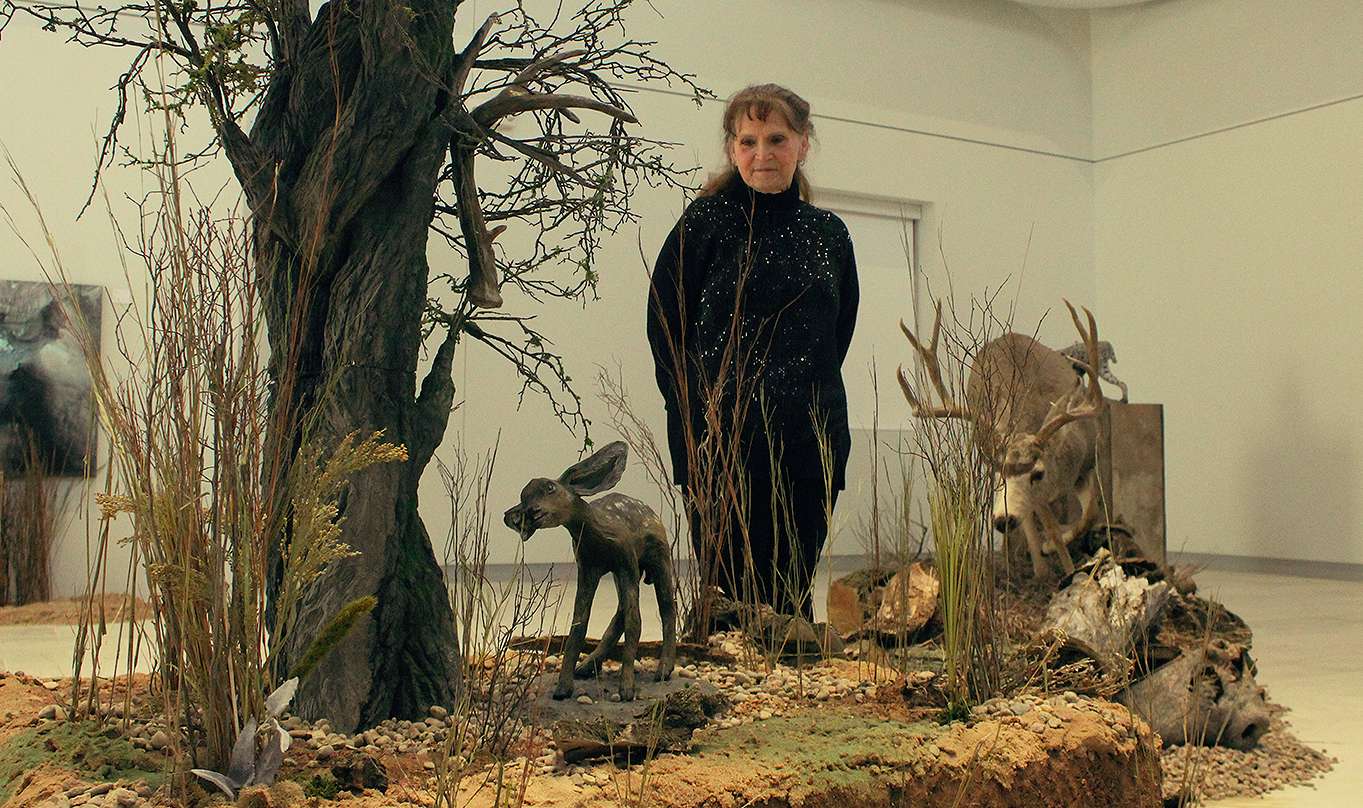Kathy Robb with her art diorama "Look dad." The piece is part of her MFA exhibit "Human Nature," which is on display now through Feb. 23 at the Moss-Thorns Gallery of Art on the Fort Hays State University campus.<br>