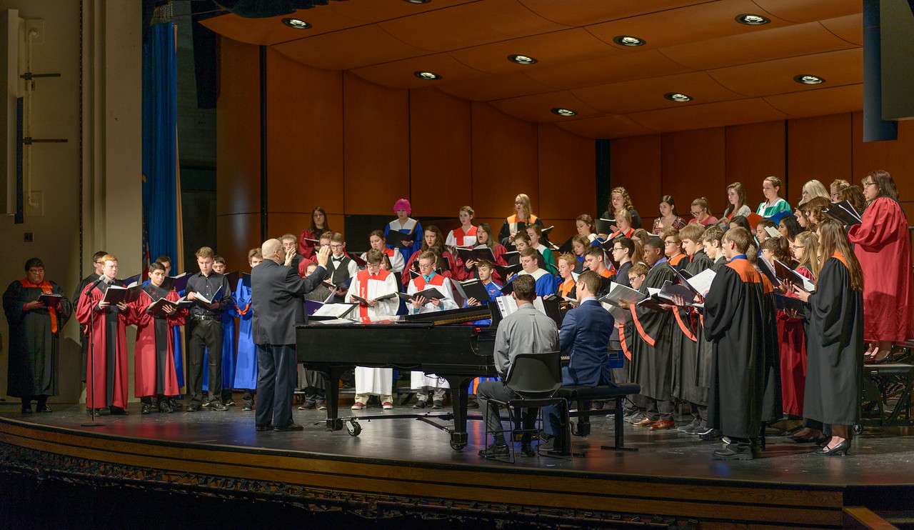 The Honor Choir, directed by Dr. Benjamin Keller, performs "Flight Song" by Kim André Arnesen during the High Plains Festival concert on Feb. 6, 2018. Guest Conductor Keller was director of choral activities and music department coordinator at Lakes High School in Lakewood, Washington, before retiring in 2013. (Photo by Daniel Binkard/Chadron State College)