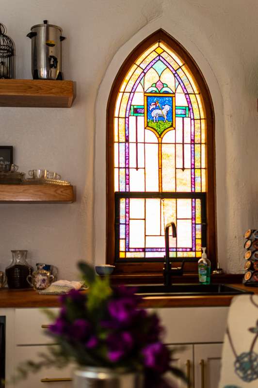 Original stained glass windows remain throughout the space.