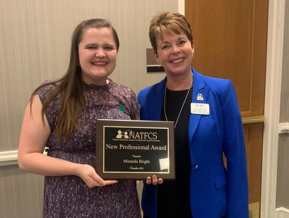Former Chadron State College student Miranda Bright, left, receives the National Association Teachers of Family and Consumer Sciences New Professional Award from Association for Career and Technical Education, Vice President of the Family and Consumer Sciences Education Division Carol Werhan, in December 2021 in New Orleans. (Courtesy photo, used with permission)