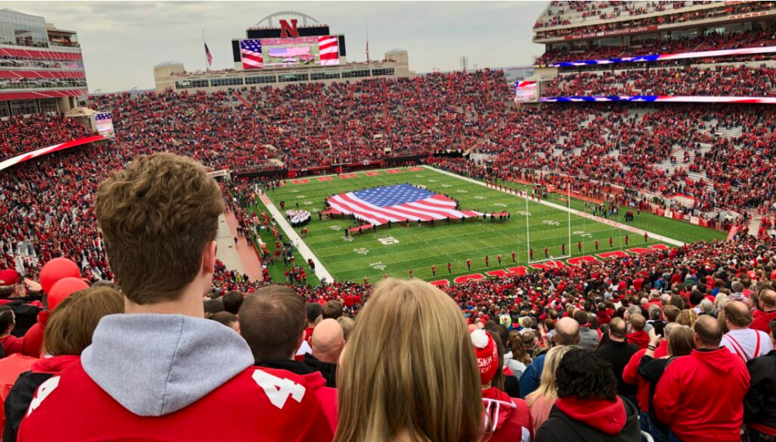 Fans cheer on the Huskers at Memorial Stadium. Beer sales at NU athletic events will be allowed after OK Friday by Board of Regents, although maybe not by next fall. (Aaron Sanderford/Nebraska Examiner)