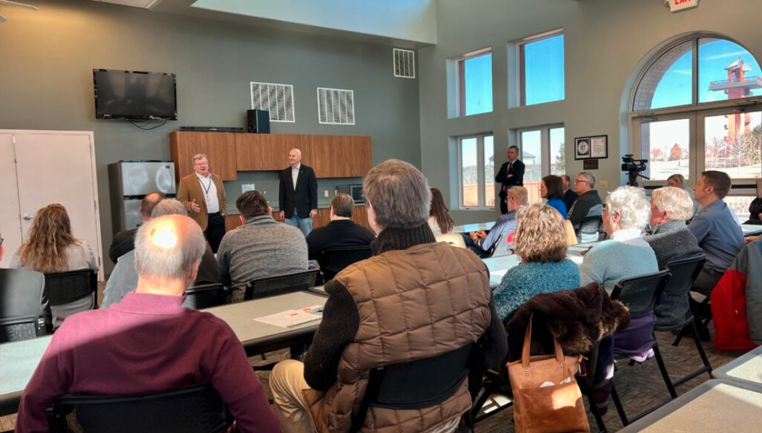 Tom Henning of Kearney, chairman and CEO of Cash-Wa, speaks to a crowd of more than 50 people as part of Gov. Pete Ricketts’ water and taxes town hall at Yanney Park in Kearney. (Aaron Sanderford/Nebraska Examiner)