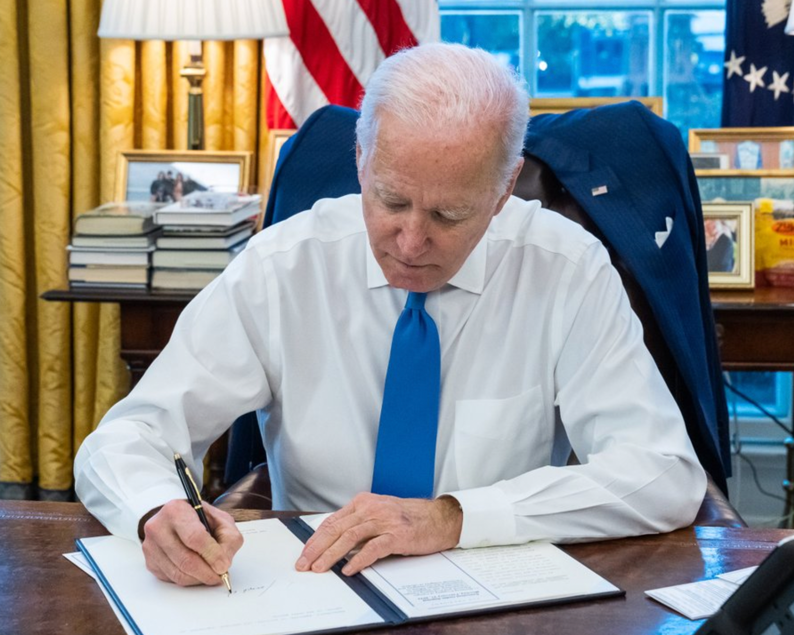 On Monday night, President Biden signed an Executive Order to deny Russia the chance to profit from its blatant violations of international law-White House photo