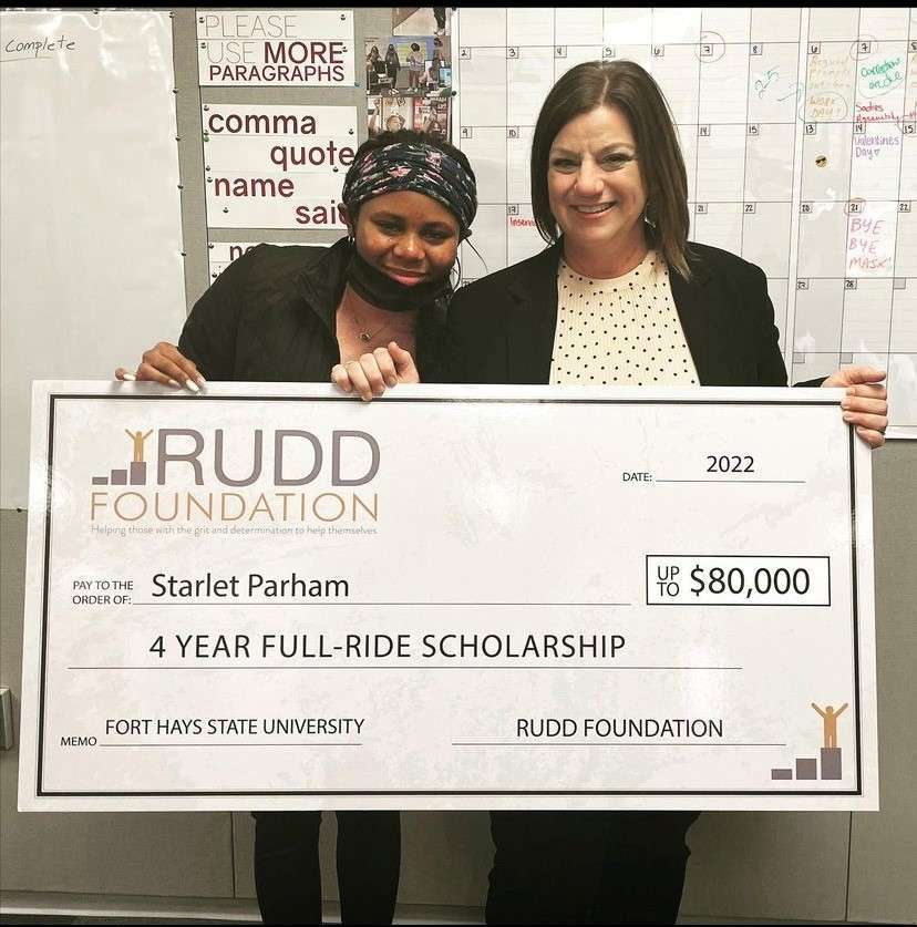 Starlet Parham, left, receives the Rudd Foundation Scholarship from Corri Roberts, program director at the Rudd Foundation. Photo courtesy Salina USD 305
