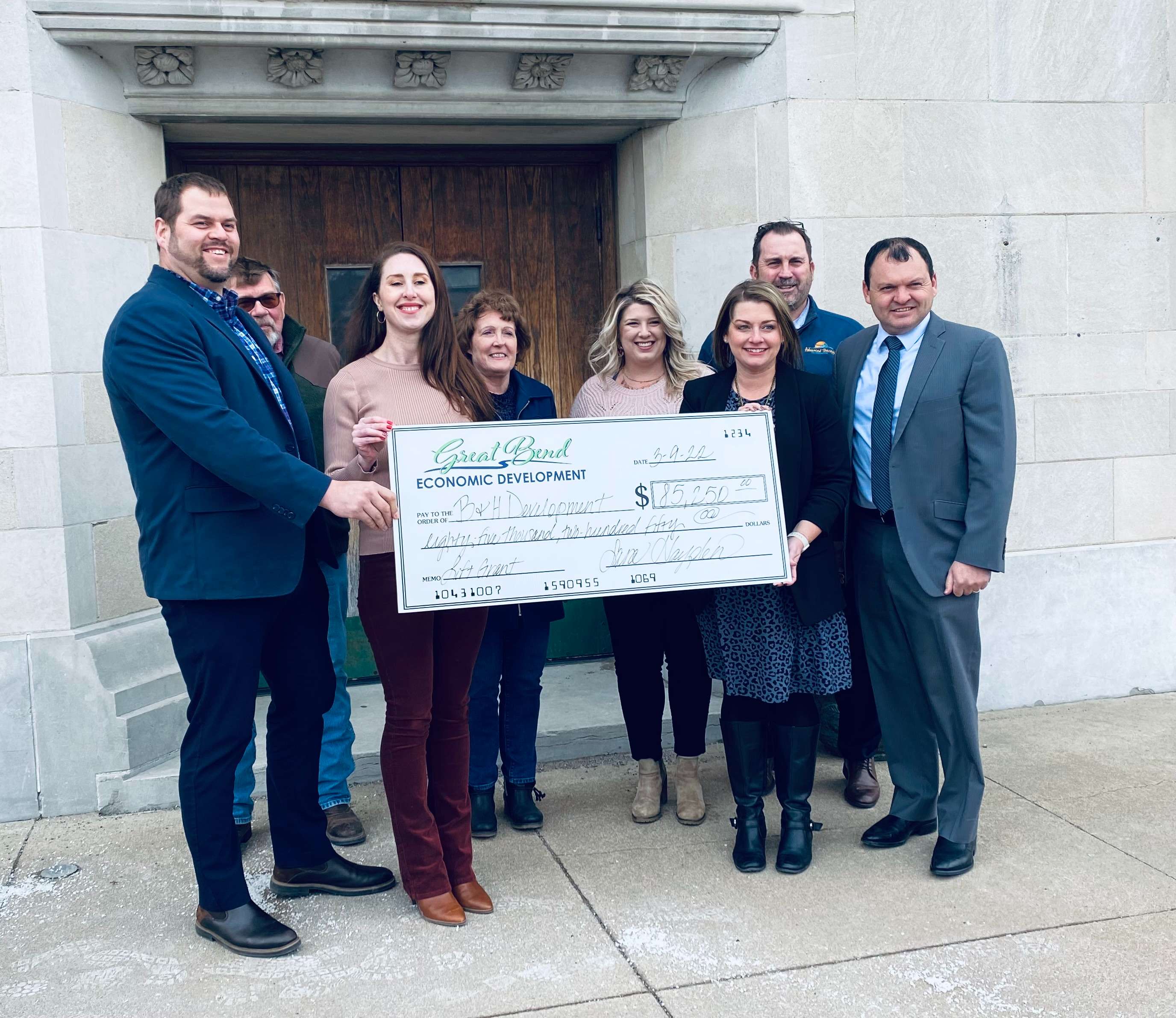 Members of B&H Development and the Great Bend Economic Development board posed Wednesday, March 9, 2022 for a picture commemorating the first Loft Project grant awarded to renovate the second floor of the 2015 Lakin Avenue building. 